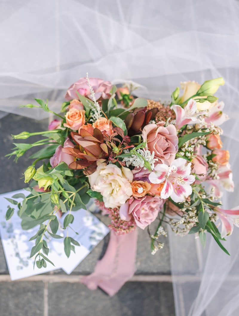 Wedding & Elopement Photographer, floral bouquet sits on the ground
