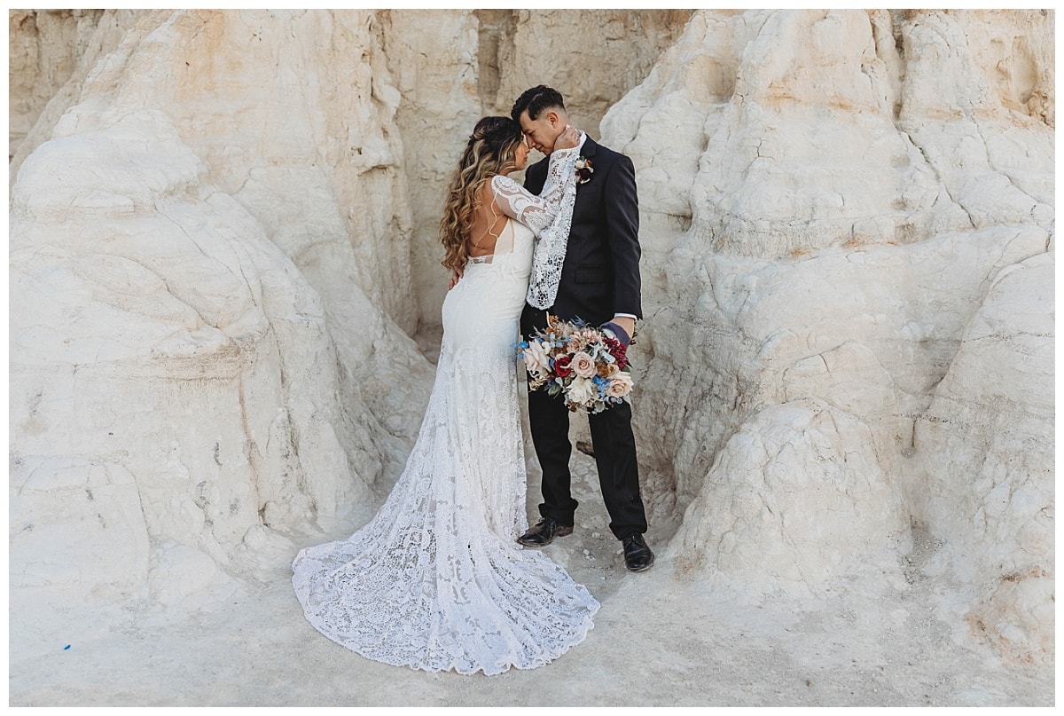 How To Elope In Colorado Springs, bride and groom with lace wedding dress at the paint mines 