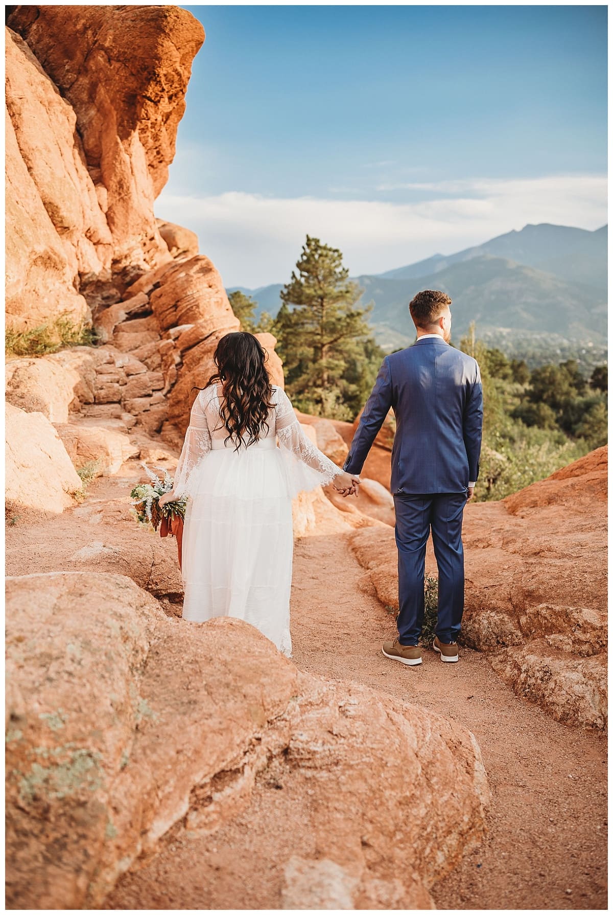 How To Elope In Colorado Springs, bride and groom holding hands at garden of the gods