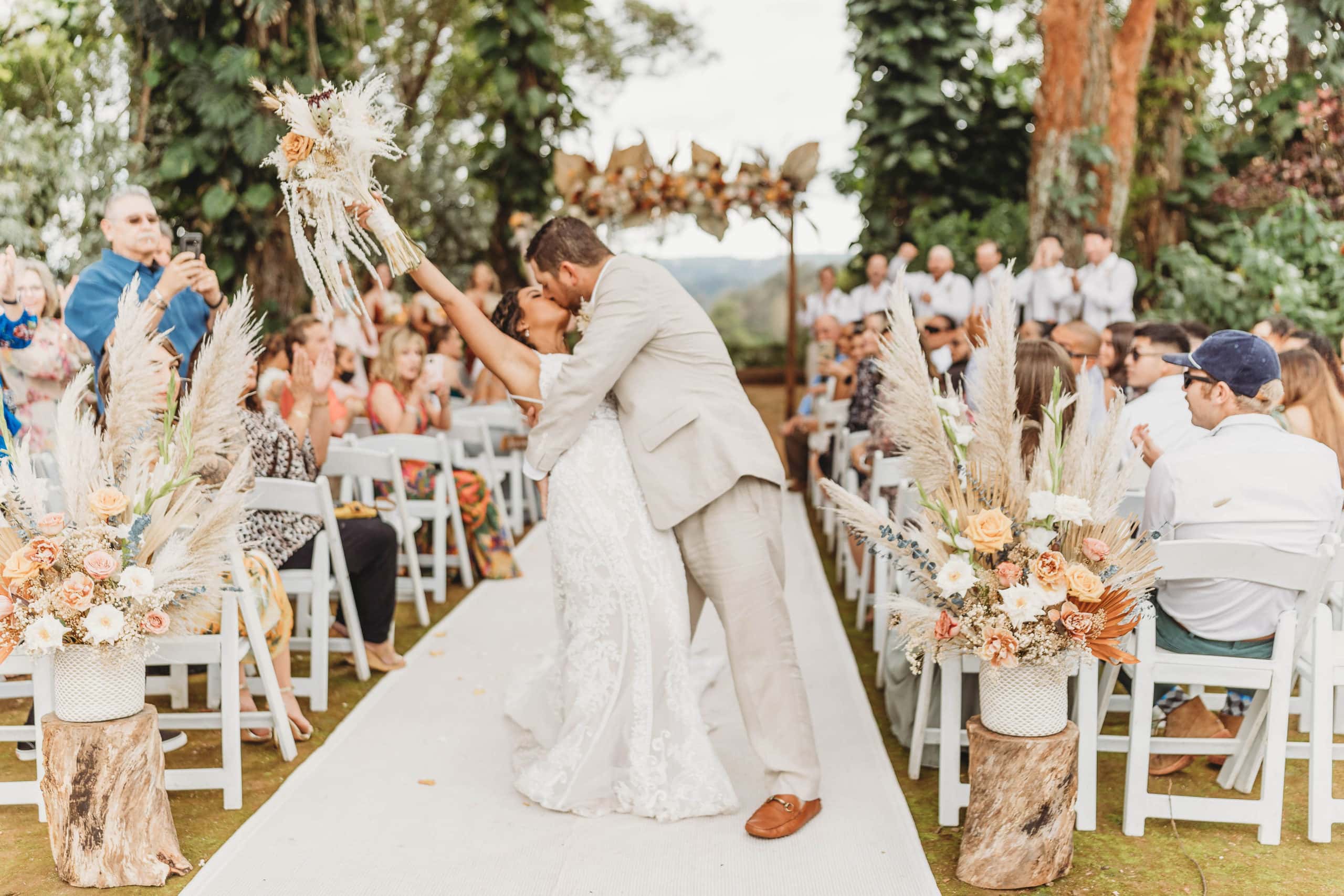 Top 5 Wedding Venues in Oahu, bride and groom ceremony kiss