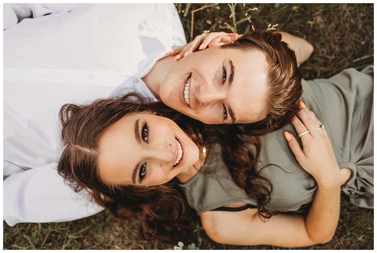 propose in colorado springs, couples engagement photos, couple laying down for photos