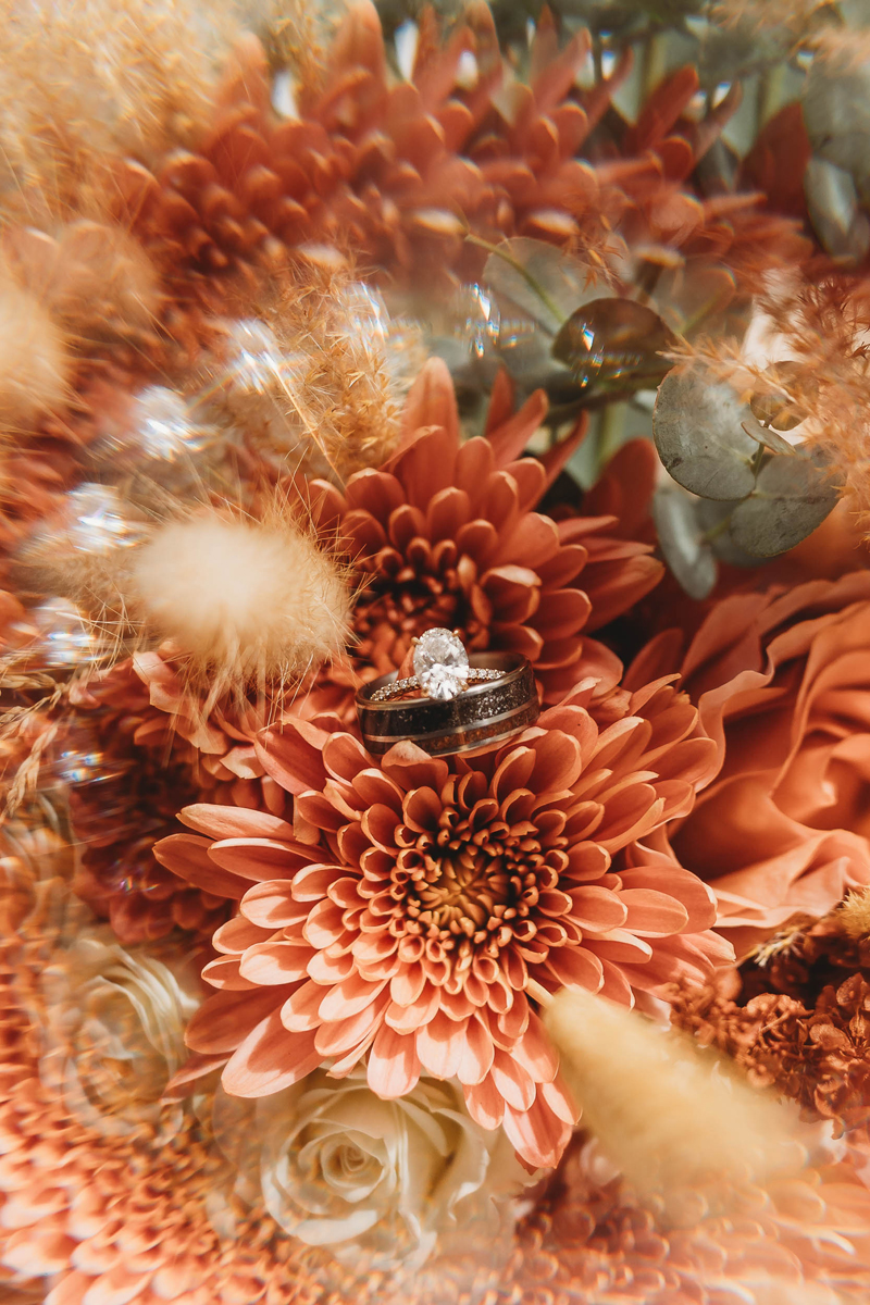 Wedding & Elopement Photographer, wedding ring on florals