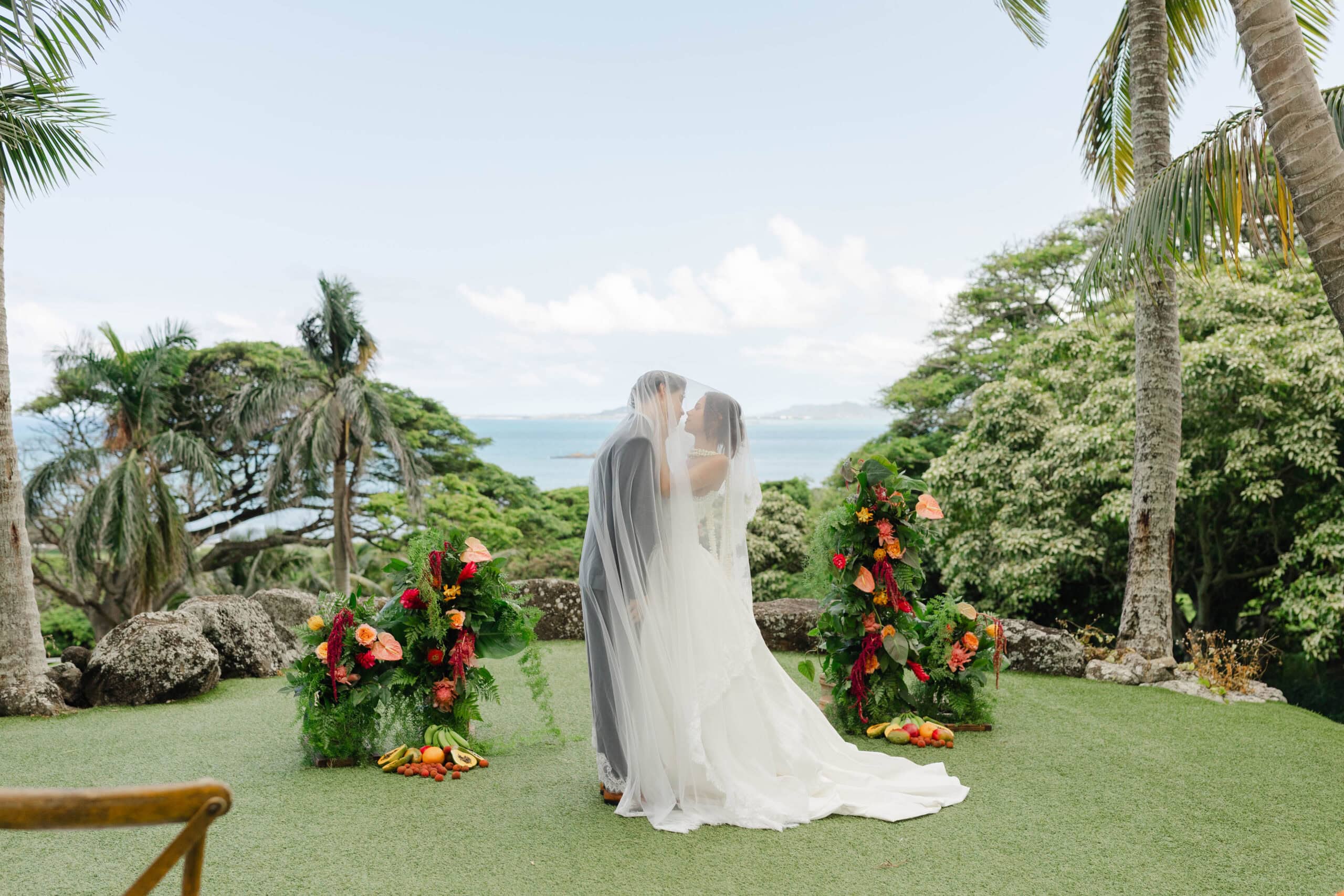 A bride and groom taking wedding portraits at their intimate wedding venue