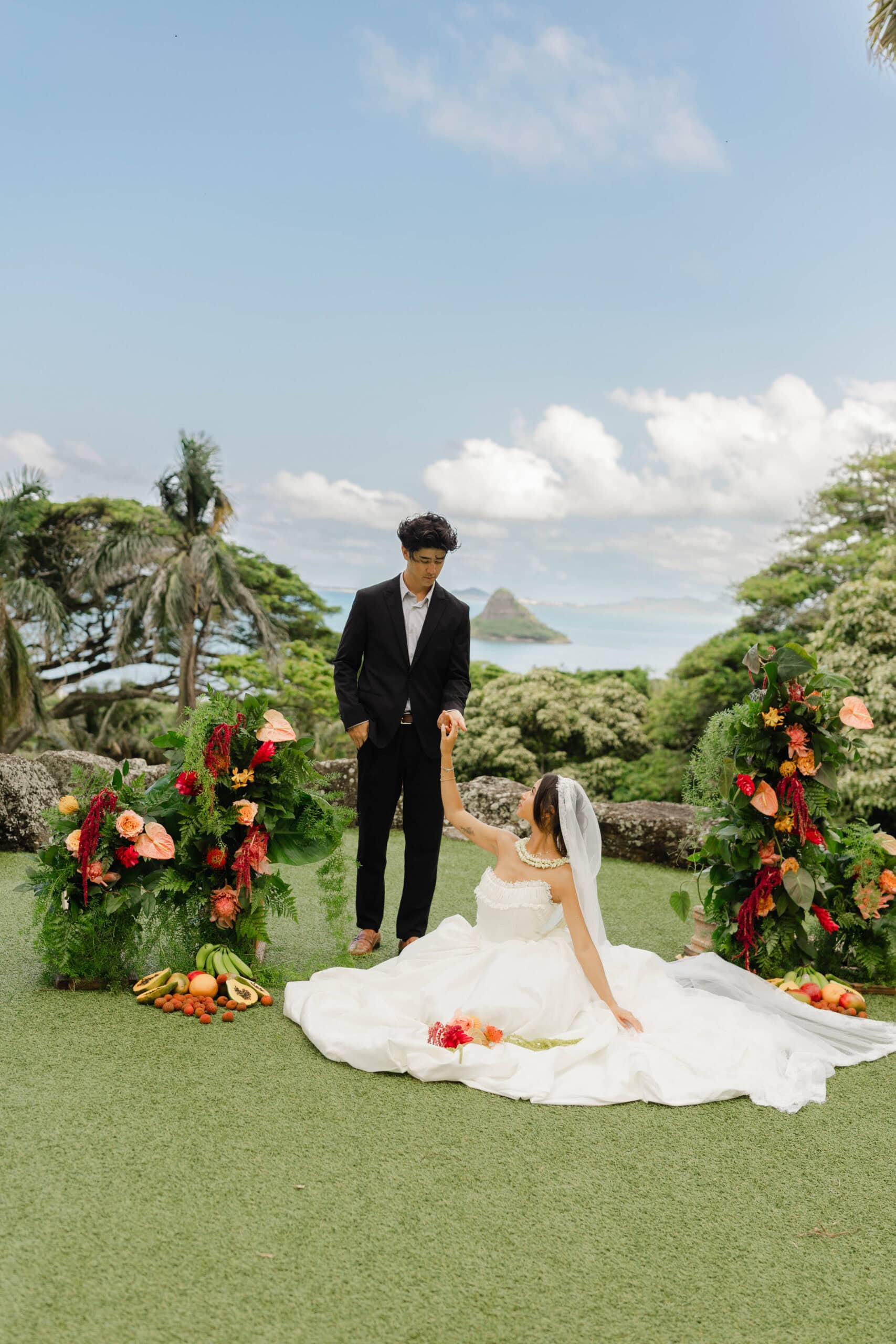 A bride and groom posing for wedding portraits
