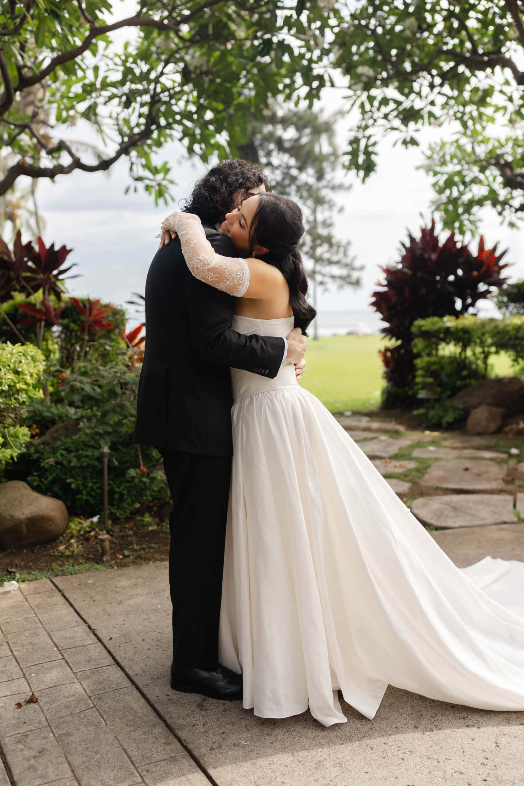 A bride and groom posing for wedding photos