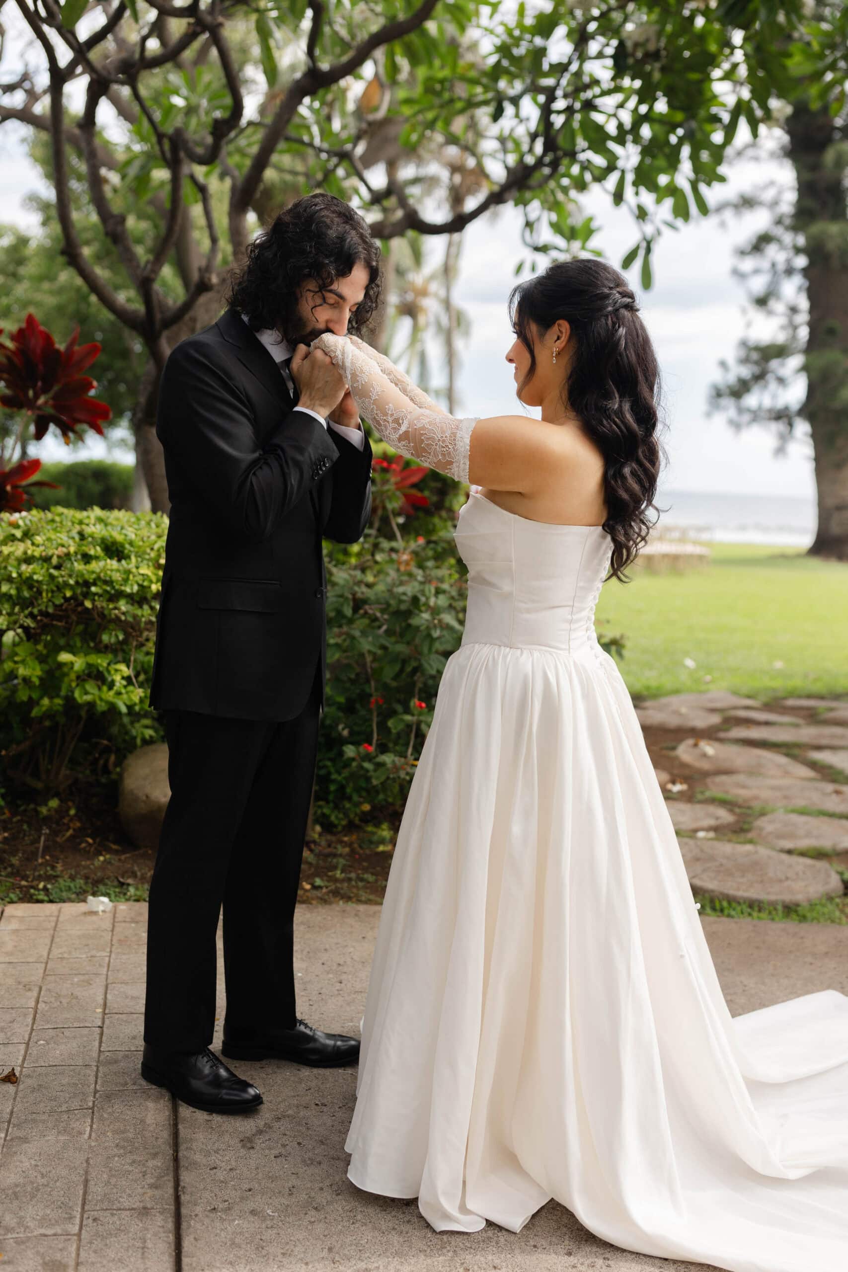 A bride and groom posing for wedding photos