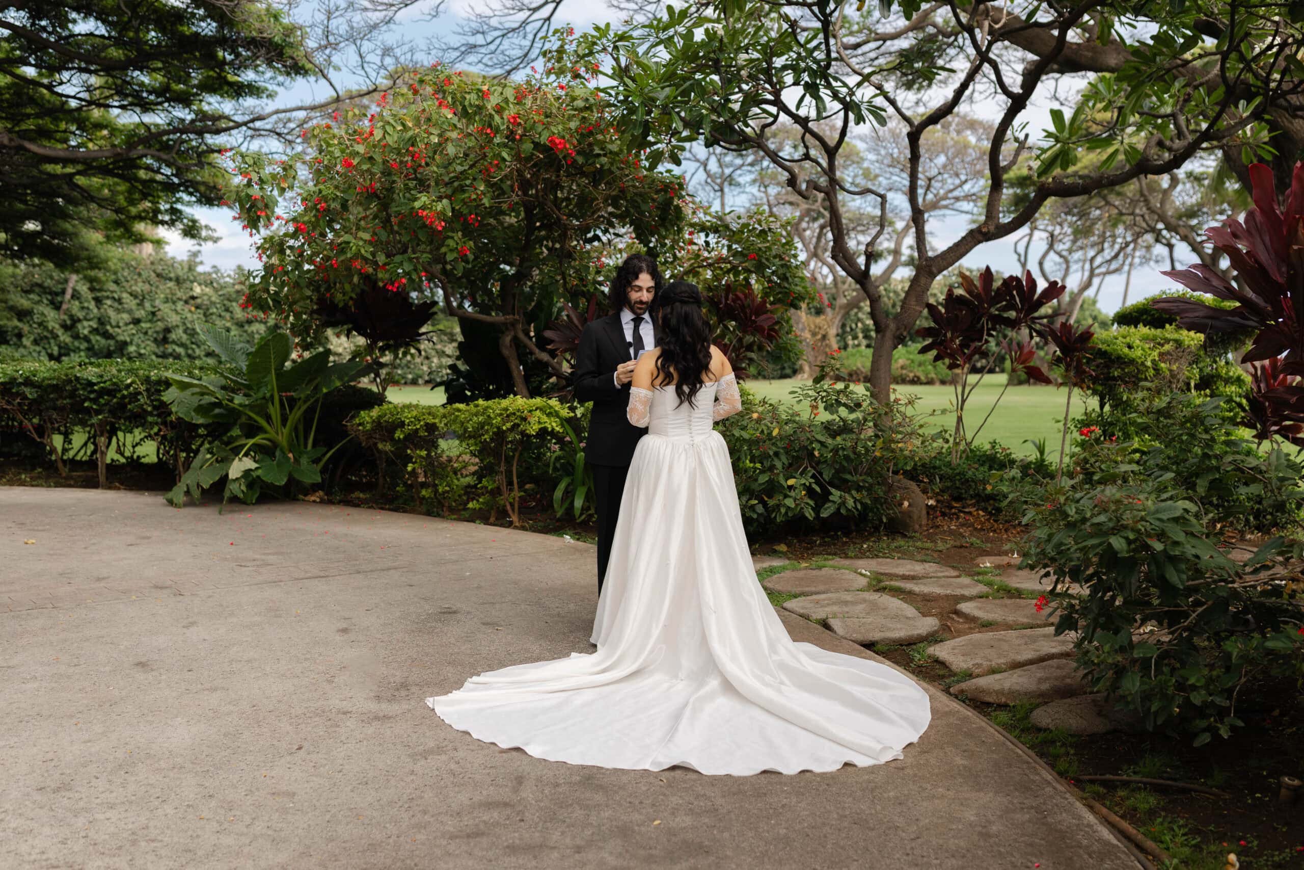A bride and groom sharing a private first look and vows