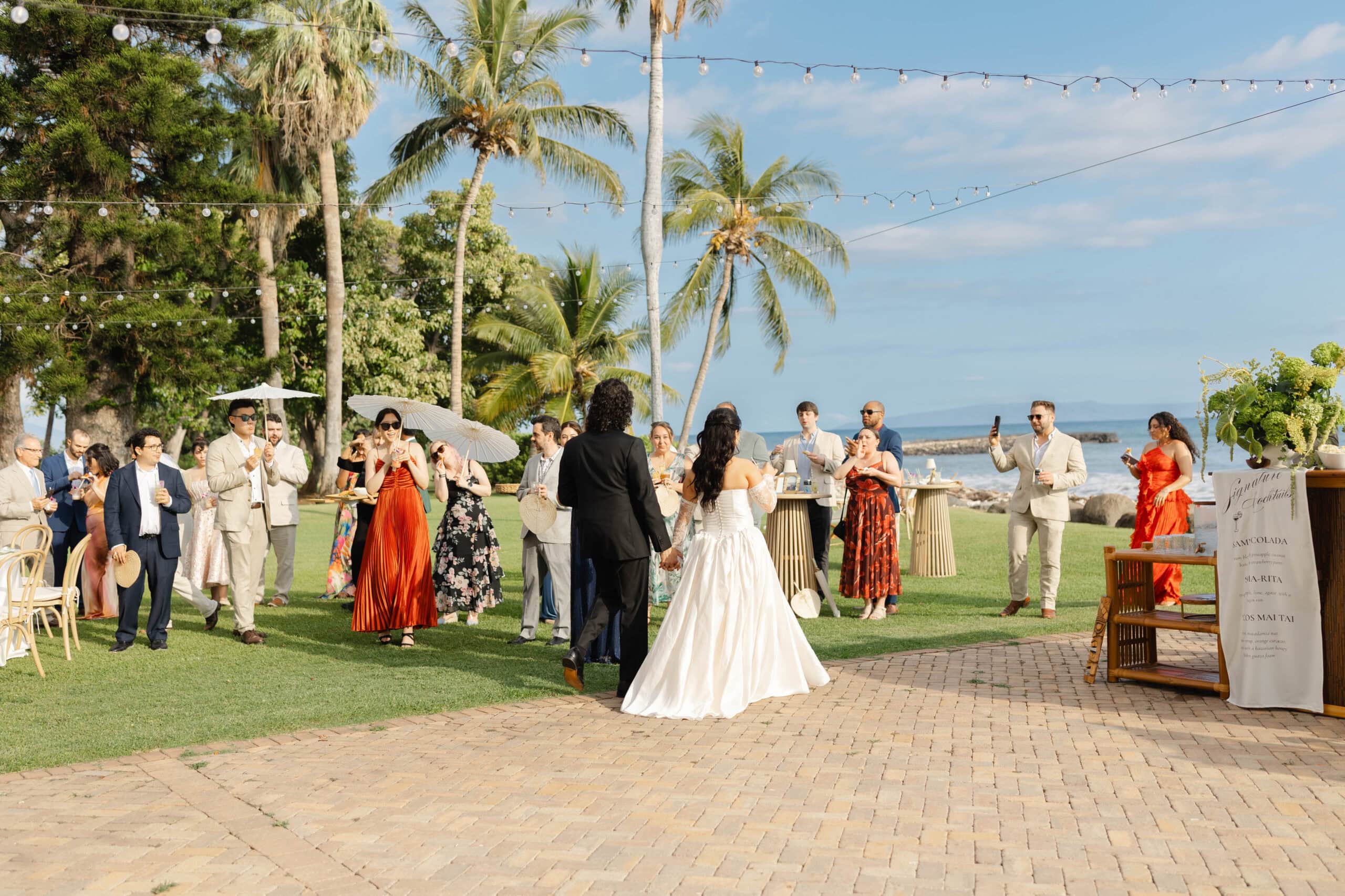 A bride and groom entering their cocktail hour