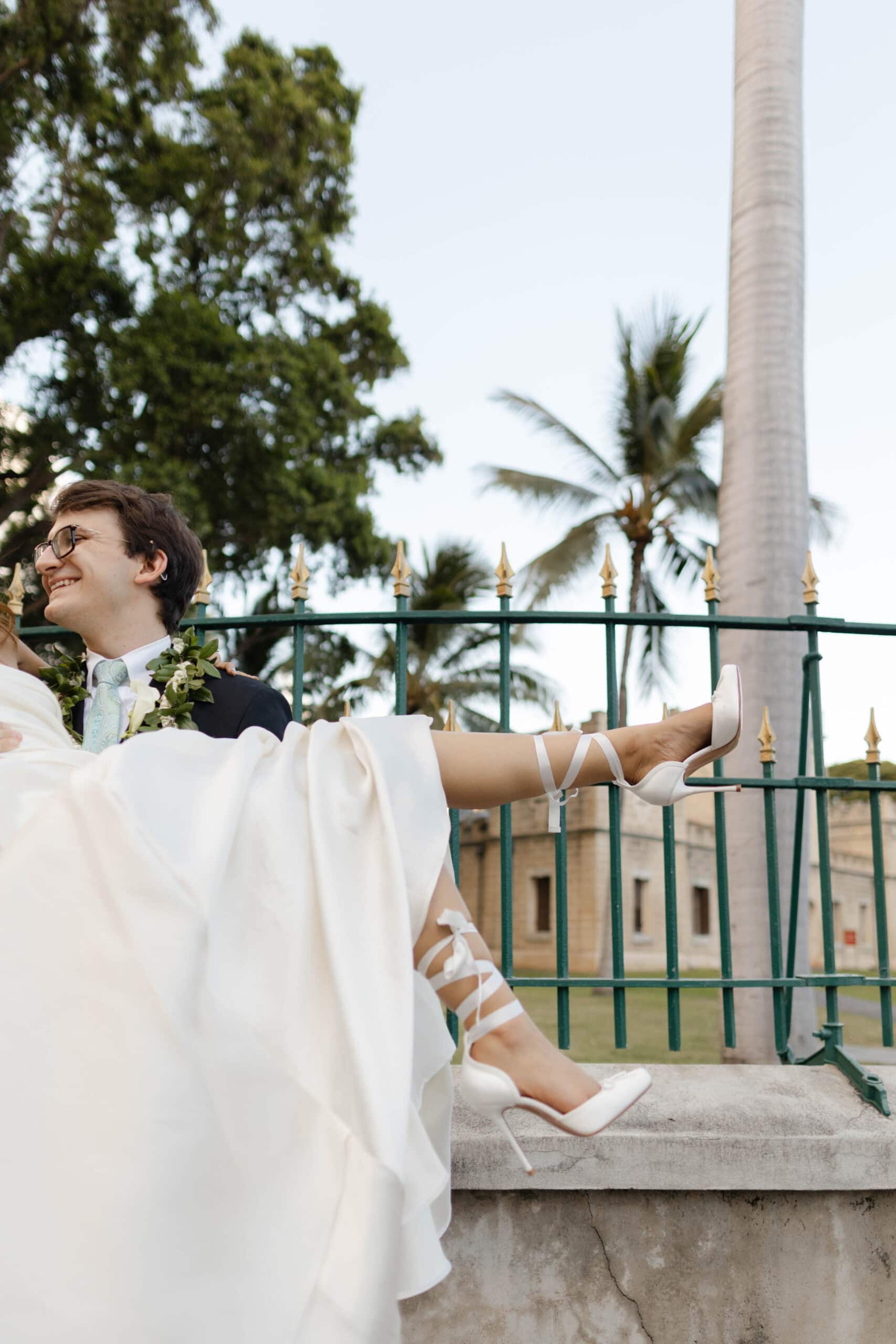 A groom picking up a bride