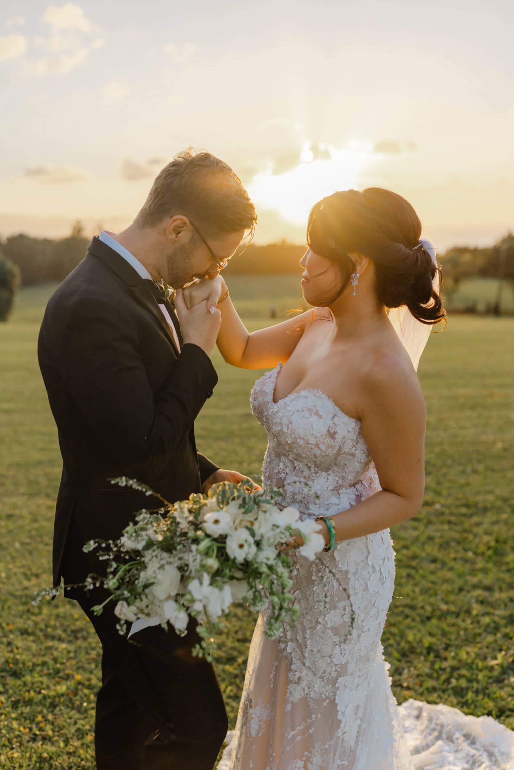 A bride and groom taking sunset wedding photos