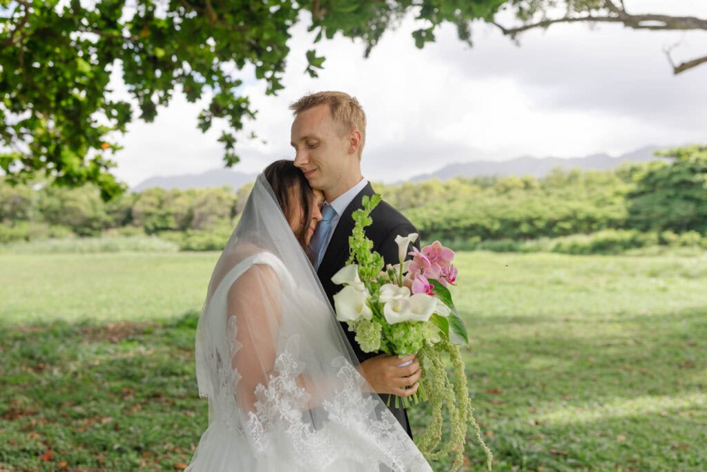 A bride and groom hugging
