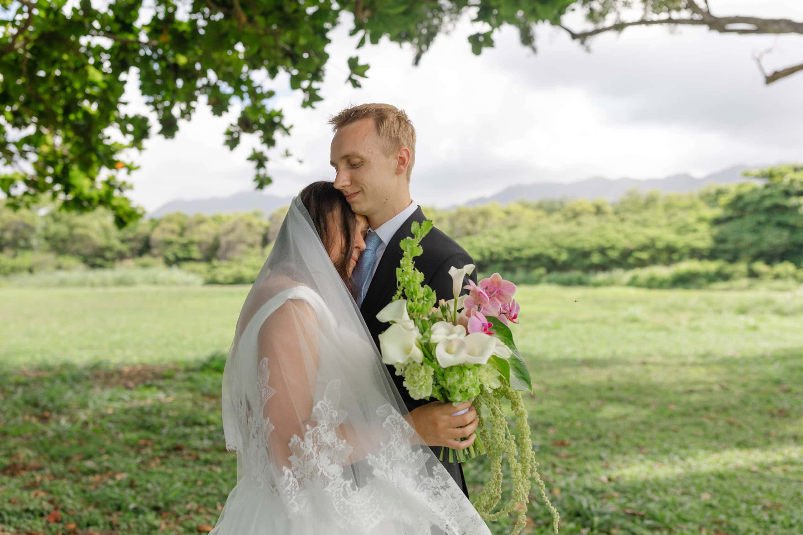 A bride and groom hugging