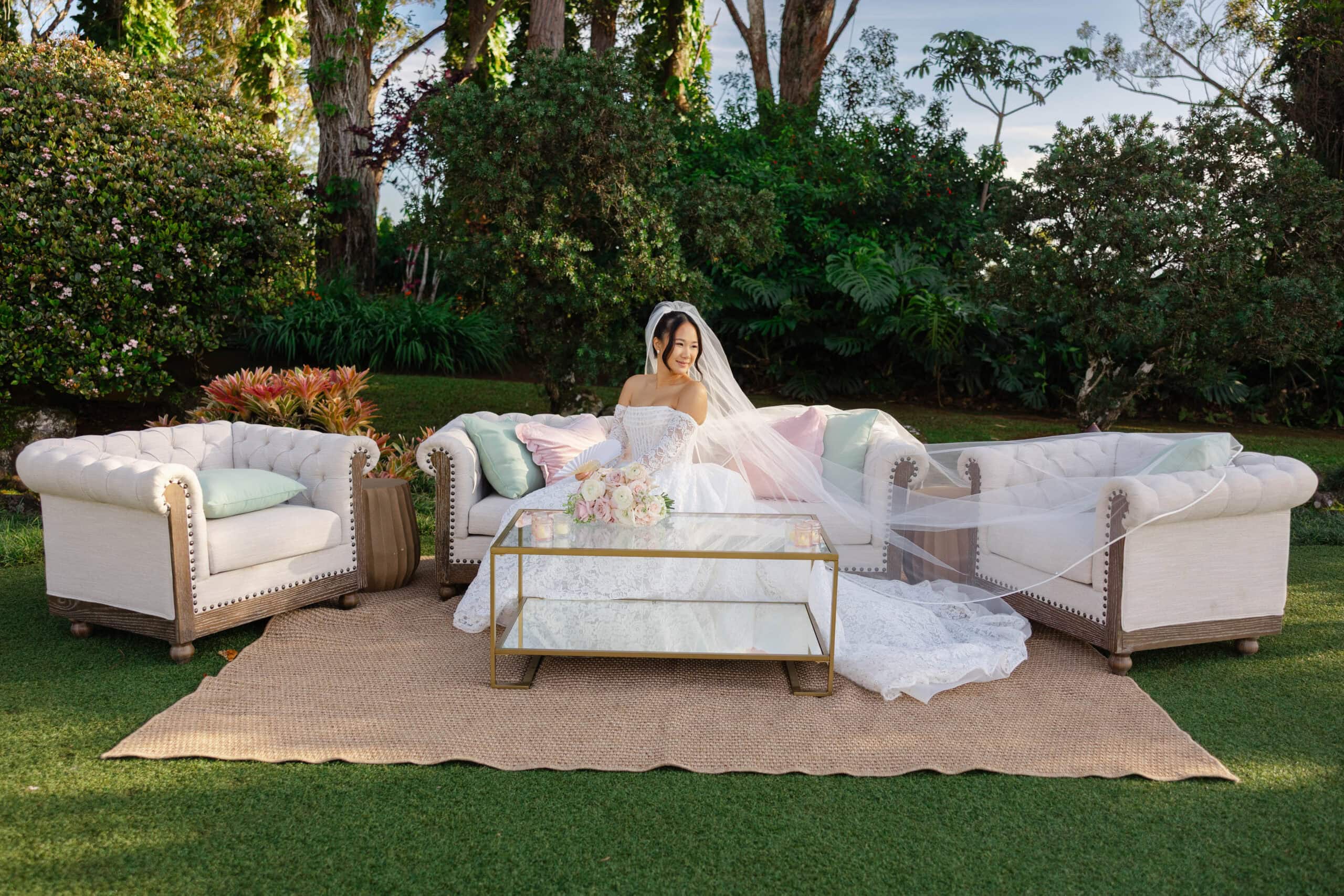 A bride on a couch at a wedding reception