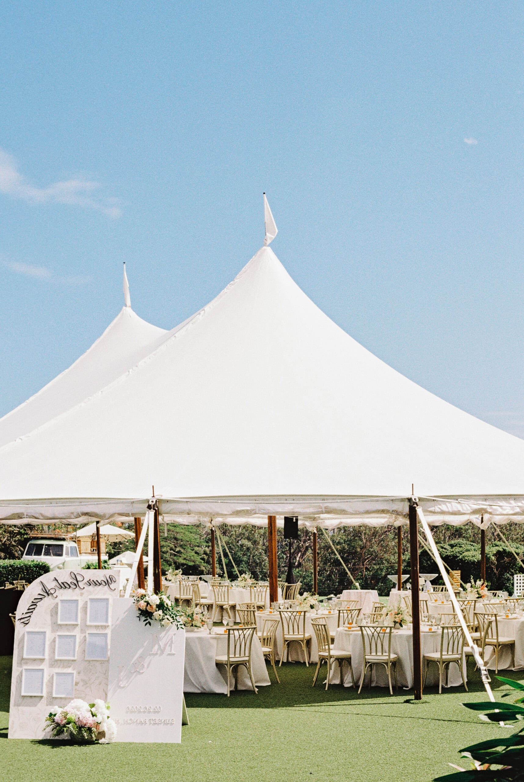 A wedding reception with an outdoor tent