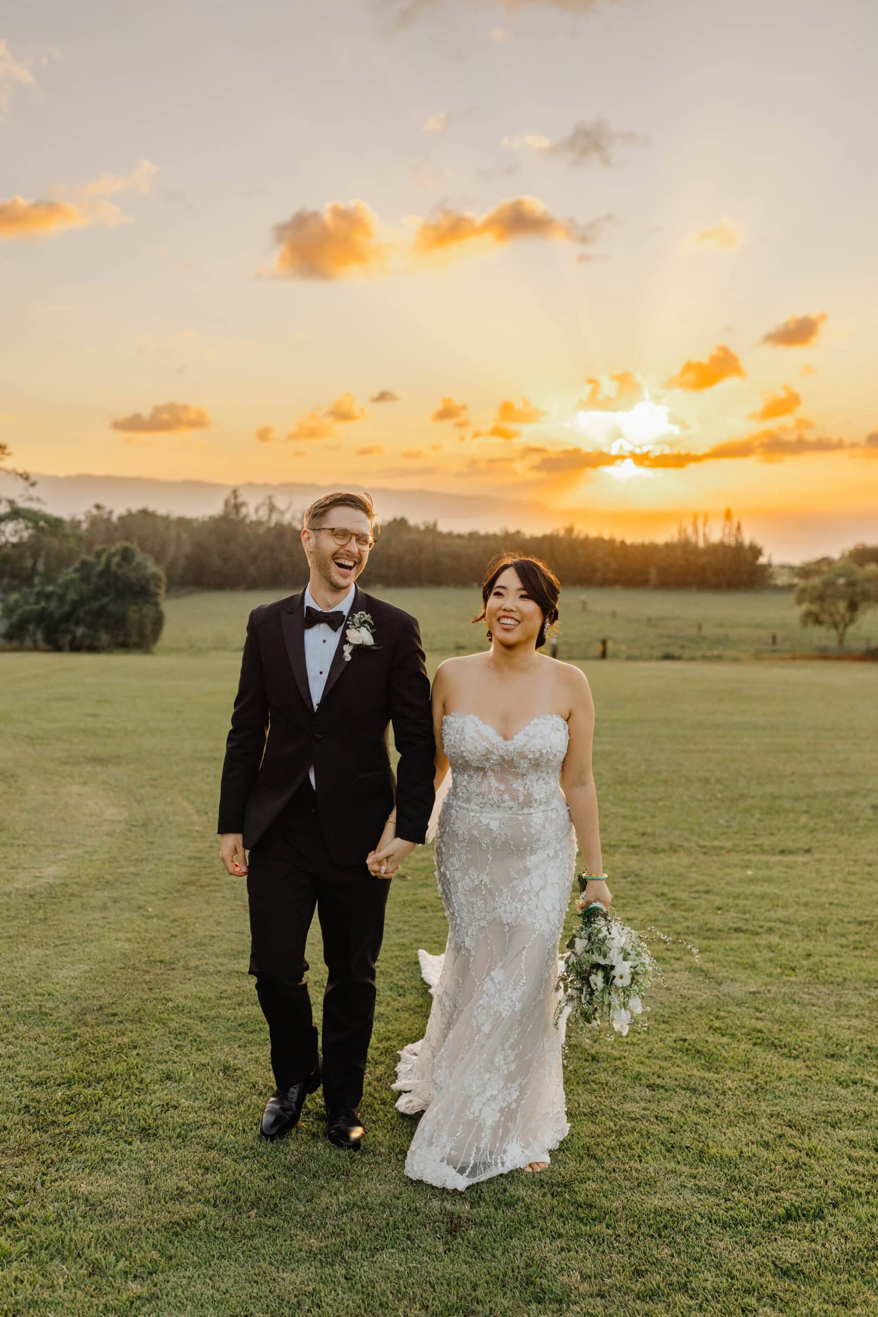 A bride and groom taking sunset wedding photos